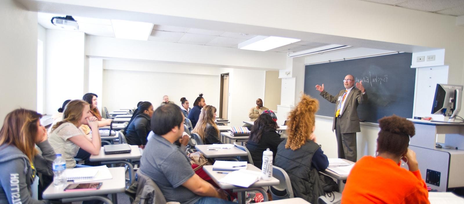 Psychology professor instructing students.