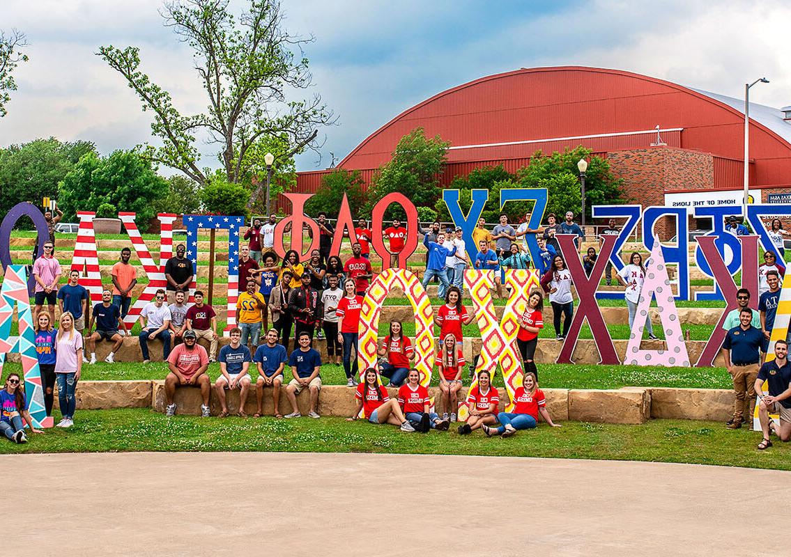 Many greek organization showing off their letters.