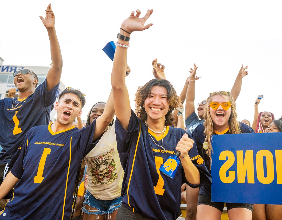 精神ed students cheering at the football stadium