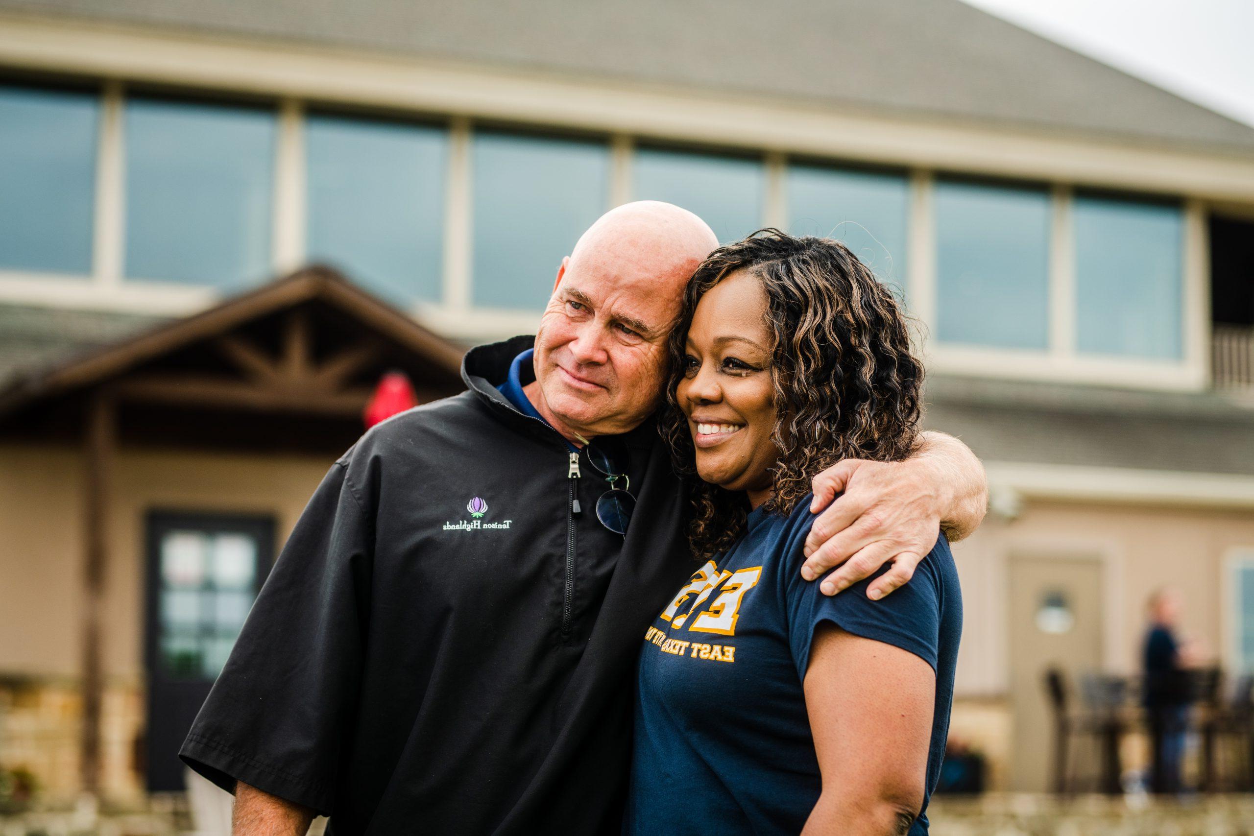 Two faculty members posing for a photo.