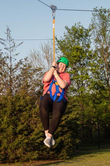 Female students ziplining.