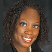 A woman poses for a professional headshot.