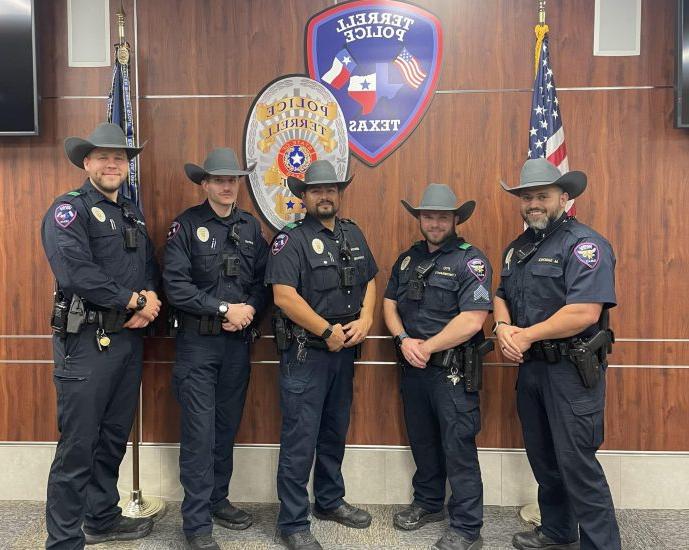 Five male officers representing the Terrell Police Department